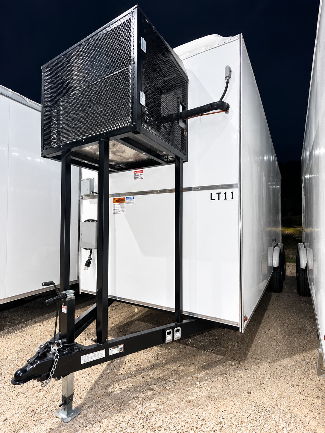 12 ft refrigerated trailer with an exterior-mounted refrigeration unit on a steel frame